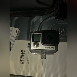 i have a gopro hero 4 touch screen never used comes with case accessories & book